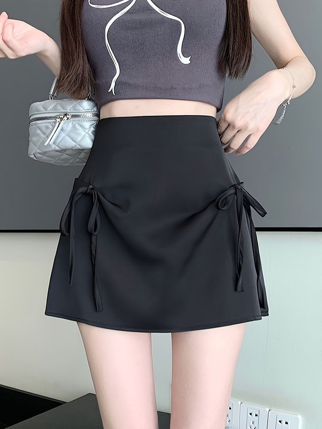 Pink Satin Half-Length Skirt for Women, Designed to Hide Imperfections, Featuring a Bow, High Waist, Slimming A-Line Shape, And Body-Hugging Fit.