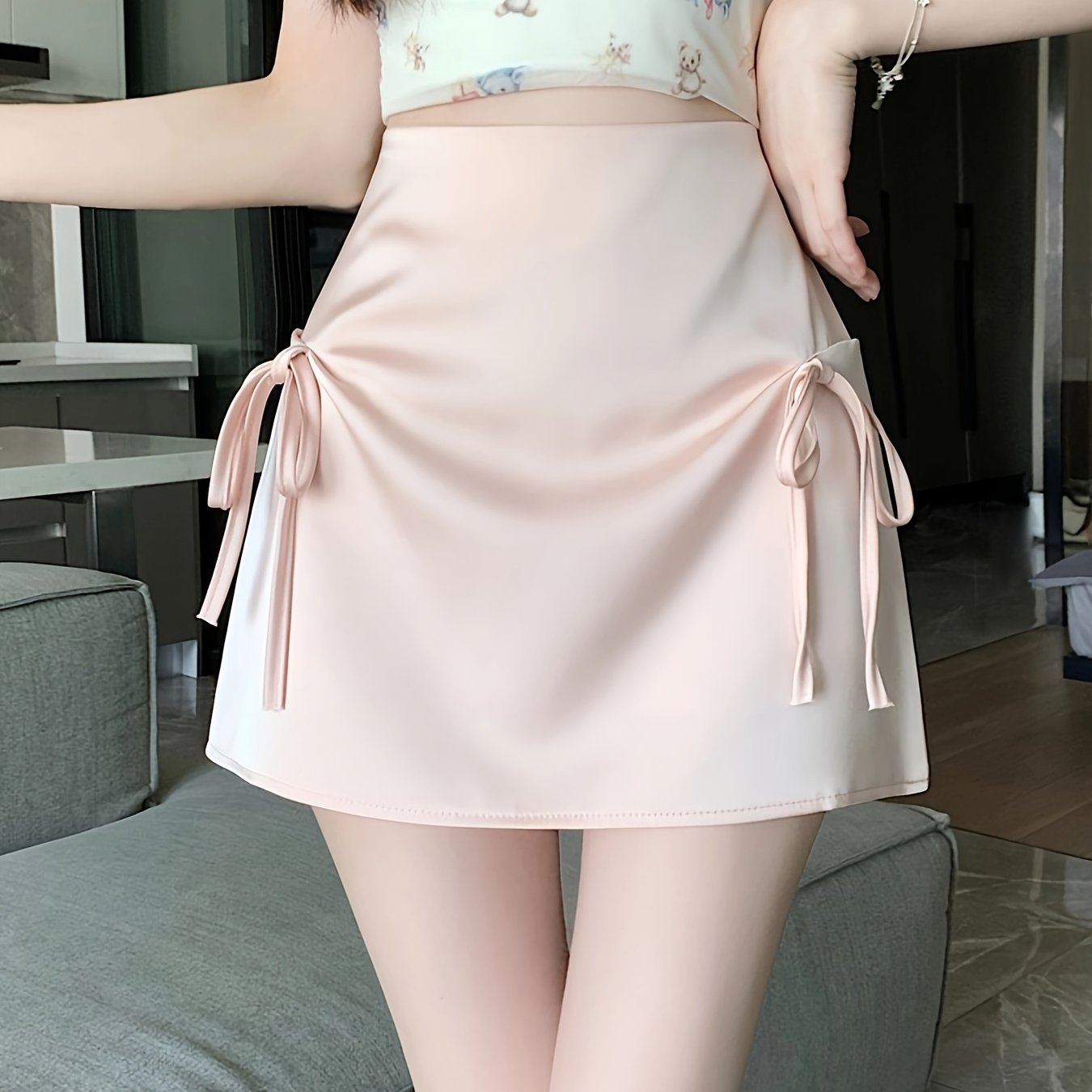 Pink Satin Half-Length Skirt for Women, Designed to Hide Imperfections, Featuring a Bow, High Waist, Slimming A-Line Shape, And Body-Hugging Fit.