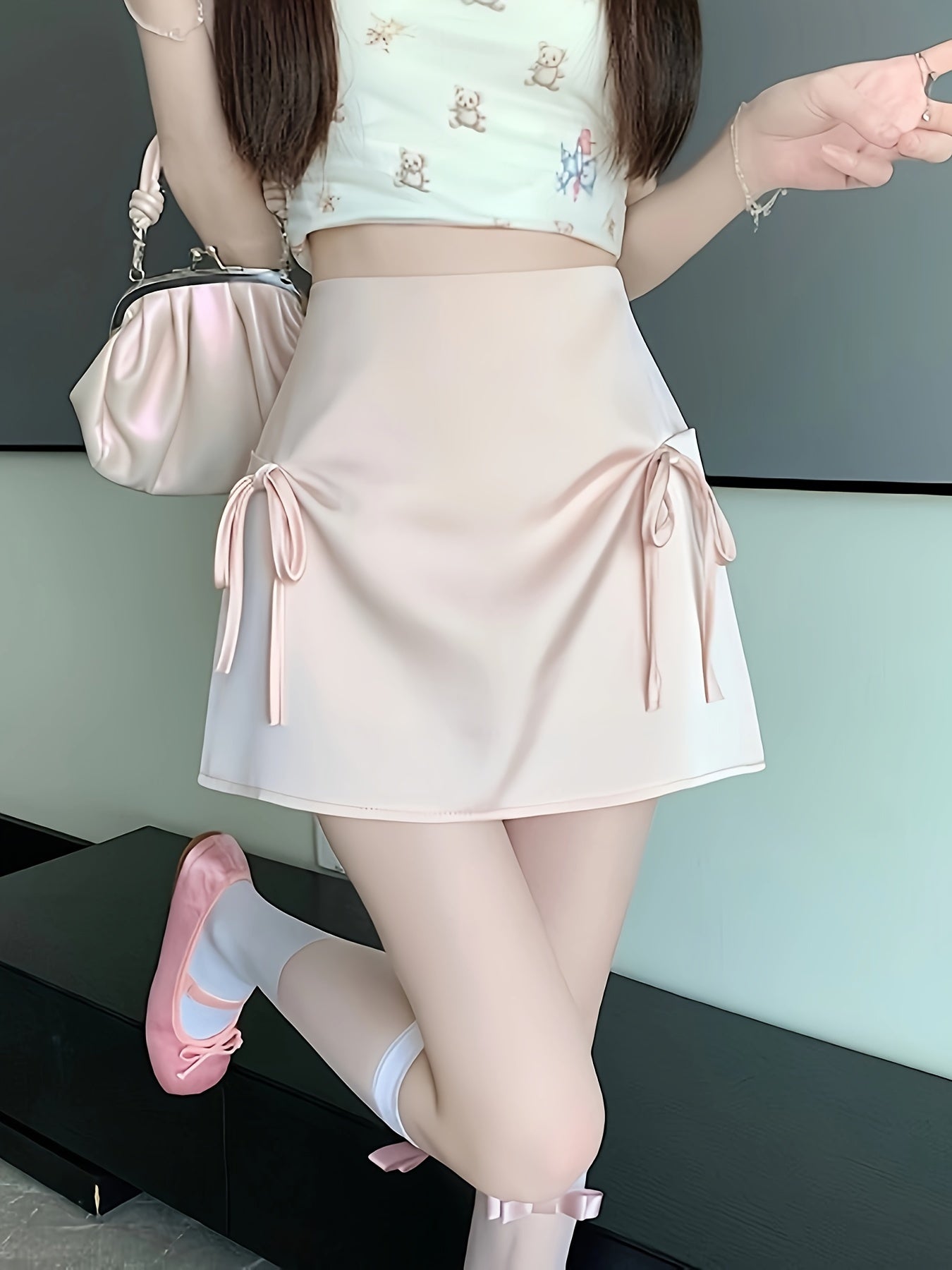 Pink Satin Half-Length Skirt for Women, Designed to Hide Imperfections, Featuring a Bow, High Waist, Slimming A-Line Shape, And Body-Hugging Fit.