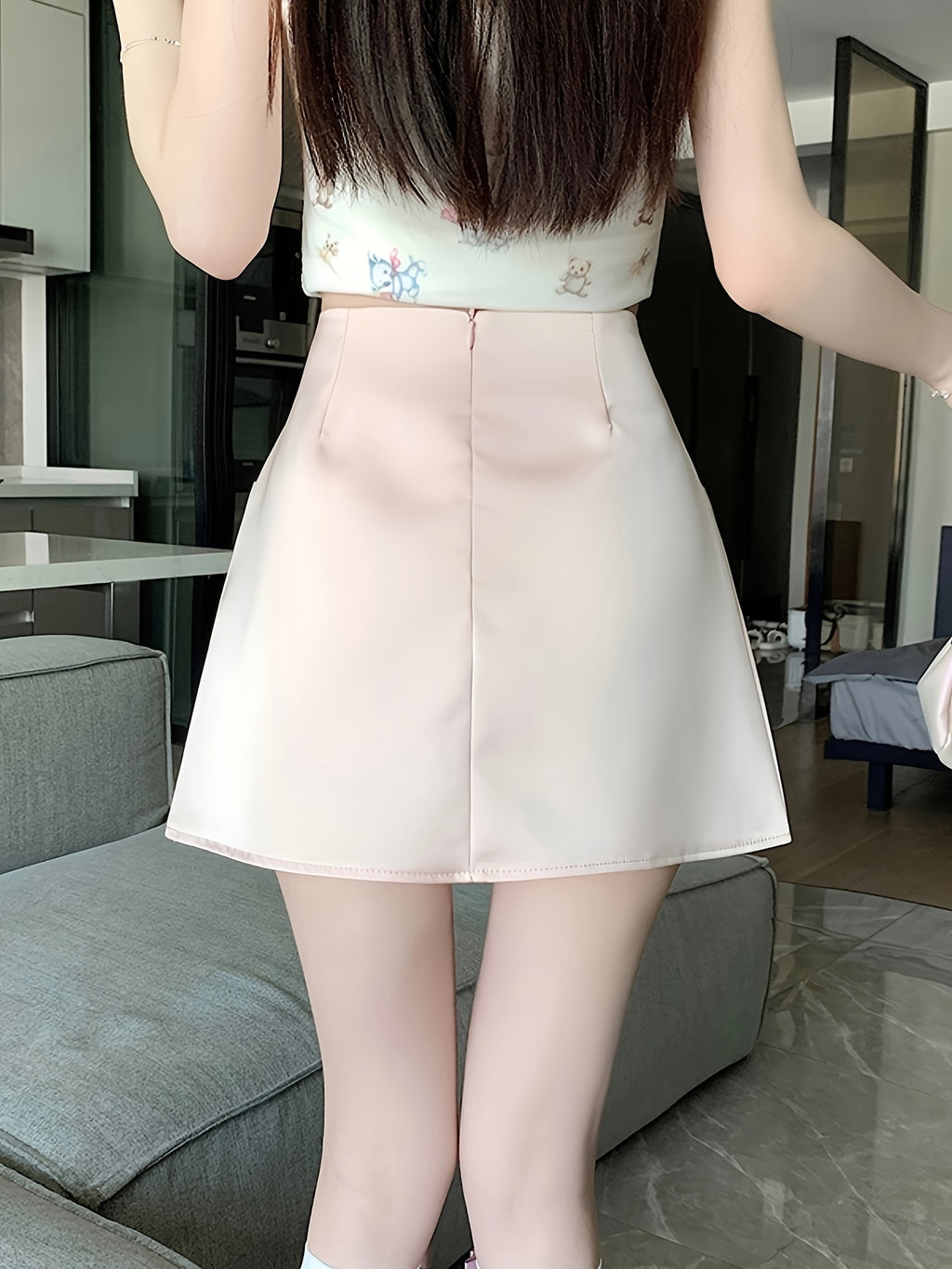 Pink Satin Half-Length Skirt for Women, Designed to Hide Imperfections, Featuring a Bow, High Waist, Slimming A-Line Shape, And Body-Hugging Fit.